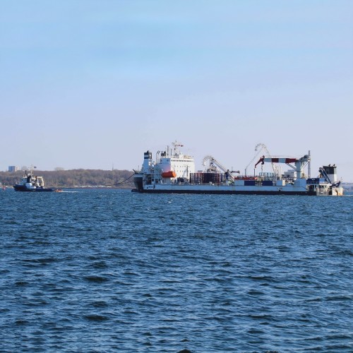 guard vessel supporting a cable laying ship