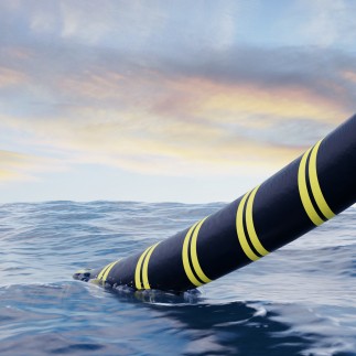 subsea cable being lowered into the water