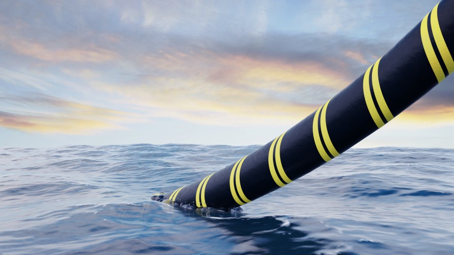 subsea cable being lowered into the water